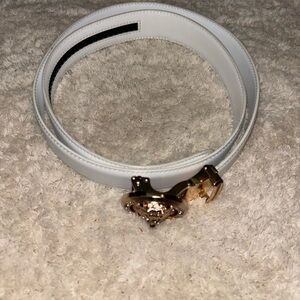 White Leather Belt with Gold wolf head buckle.